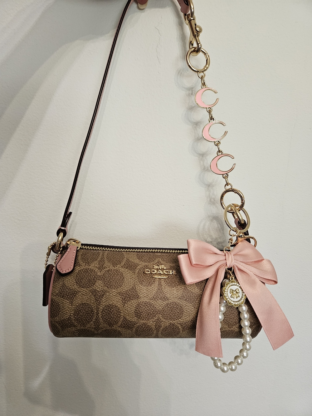 Coach Nolita Barrel Signature Canvas Wristlet with Pink Bow Charm